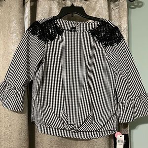 Black and white flannel with ruffle sleeves.